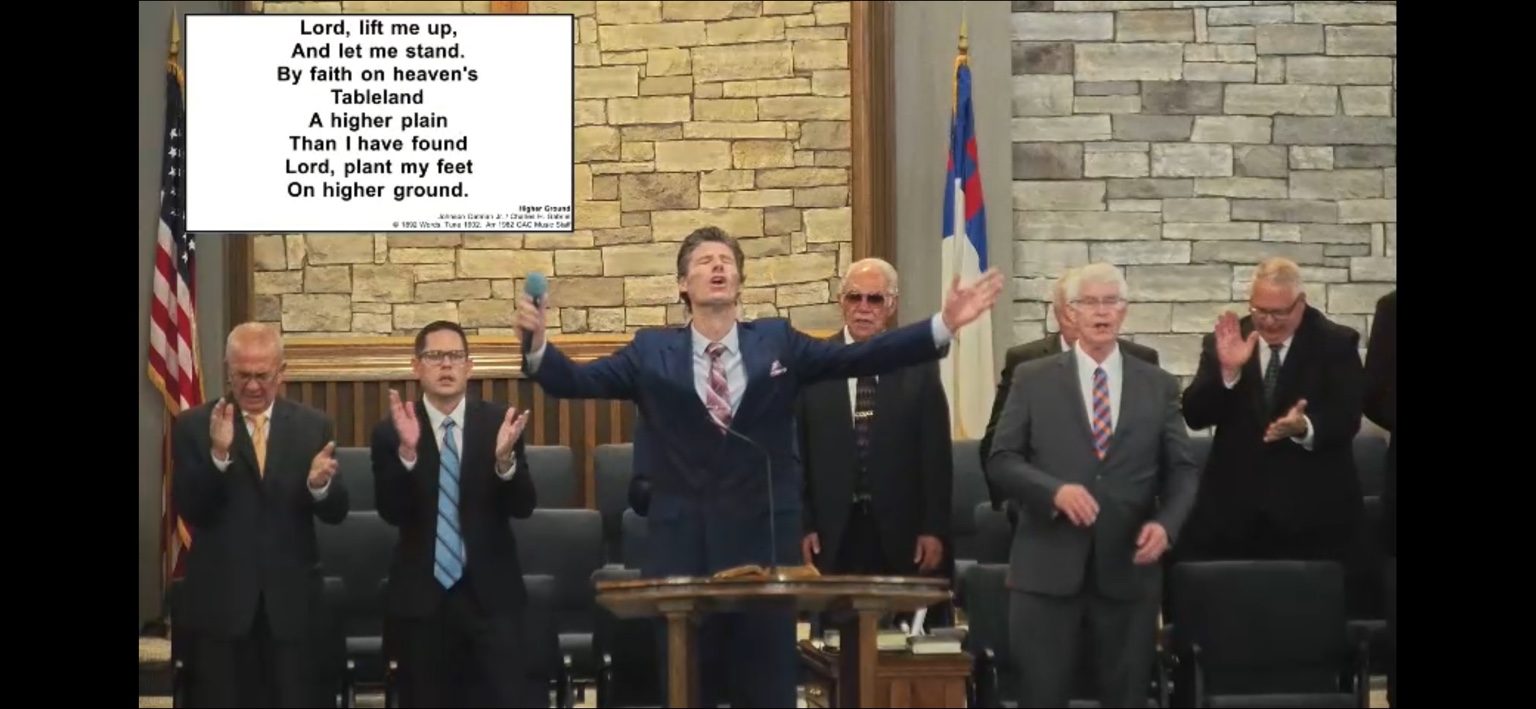 Rev. Billy McCalip leading worship during a church service